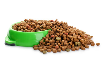 Bowl full of dry pet food on white background