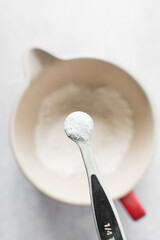 A teaspoon of baking soda or baking powder