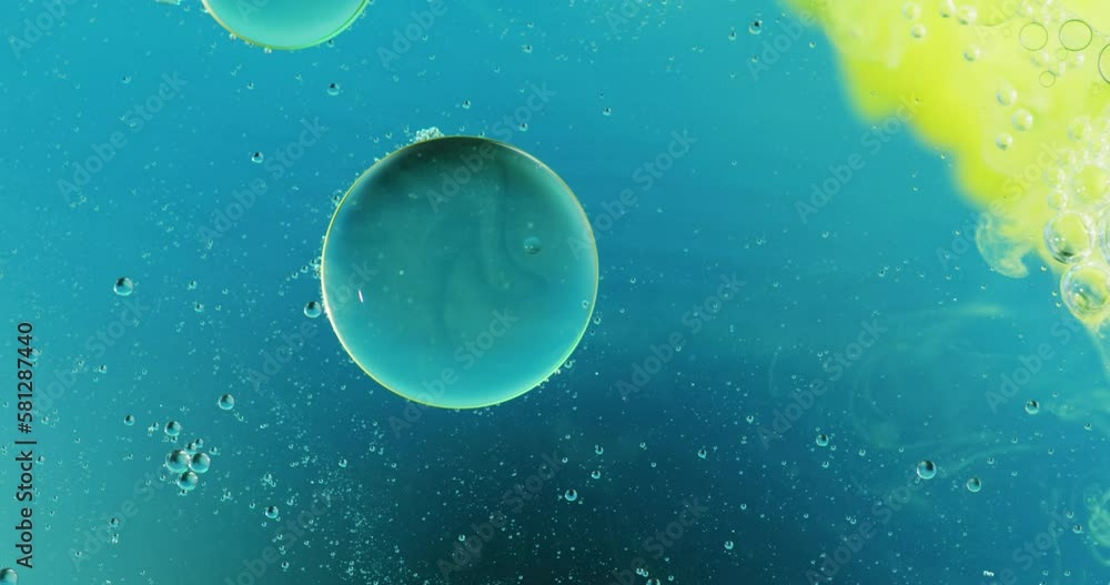 Canvas Prints Animation of bubbles and green liquid moving on blue background with copy space