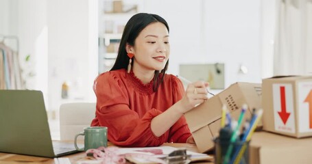 Box, ecommerce and laptop with asian woman writing for order, delivery and online shopping distribution. Seller, package and retail with small business owner for parcel, shipping and labelling
