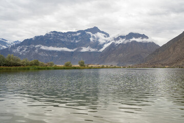 Fototapeta na wymiar A pond river lake in Karakoram high mountain hills. Nature landscape background, Skardu-Gilgit, Pakistan. Travel on holiday vacation.