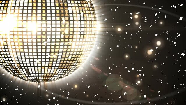 Animation of rotating mirror disco ball over falling confetti, lens flares against black background