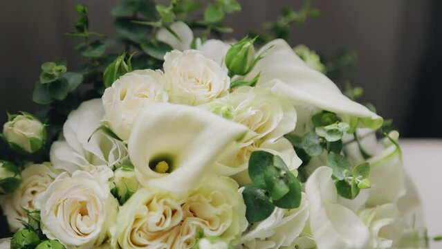 Close-up of the petals of a bouquet of fresh flowers. The camera moves smoothly taking pictures of the bouquet