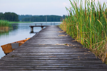 Wooden jetty on the lake in summer