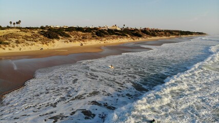 Empty sea coast with sandy beach, watching a California shore drone aerial