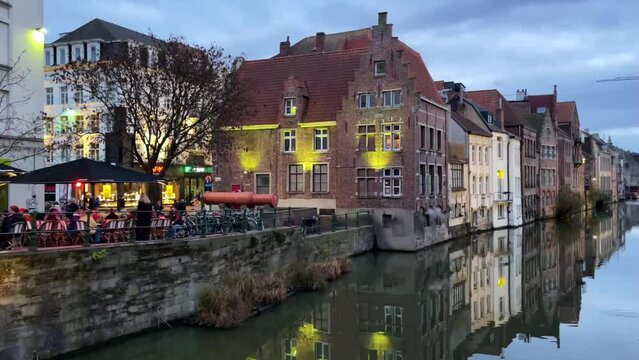 Ghent at night. View of the street, river and medieval houses of a city in the Flemish region of Belgium. Travel concept