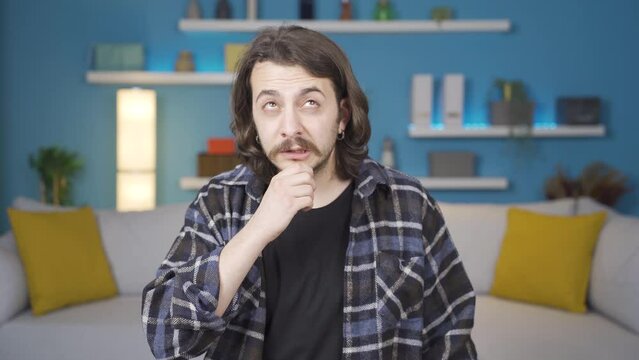 Thoughtful man looking for Idea.
Man trying to come up with an opinion on a topic. He's running a secret business.
