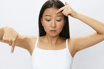 Asian woman facial skin problems, acne and inflammation, red rashes and allergies, chicken pox,...