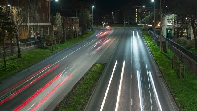 Norwich England timelapse sequence over Katedral hutch with heavy traffic movement at night time. High angle shot.