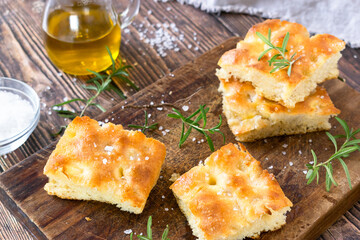 Focaccia with rosemary, olive oil and salt, a traditional Italian flatbread recipe.