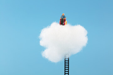 Miniature creative lonely old man in the cloud
