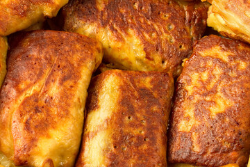 Stuffed pancakes close-up. Fried pancakes with stuffing.