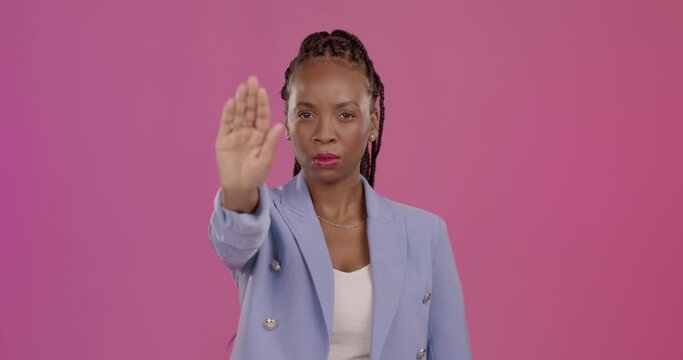 Face, stop and hand of black woman in studio with no, warning and gesture against pink background. Portrait, palm and hands of protest by female with reject, ban and defence, emoji and forbidden