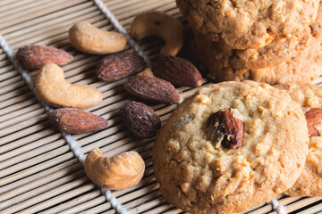 Almond and cashew nut cookies on white plate.