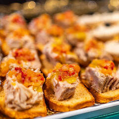 Tuna snacks displayed in a store to consume on the spot, Mercado de San Miguel, Madrid.
