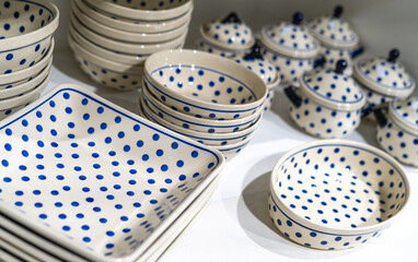 Closeup handmade pottery with blue pattern produced in Boleslawiec, Poland