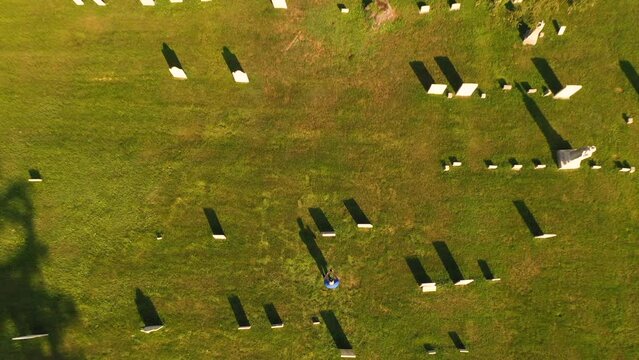 A person researching family history drone Birds Eye of  Gorham Cemetery. An old grave yard that with graves that date back to the the early America 1800s located in the country of New York State, USA
