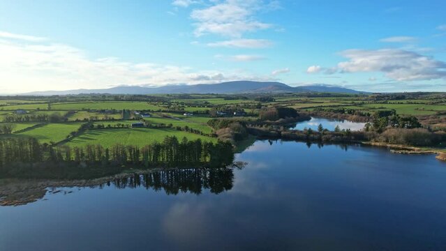 Peaceful scene from Ballysunnock over the lush green farmland of Waterford to the Comeragh Mountain range