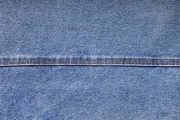Blue jeans background and texture close up.Denim seam. 