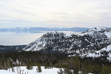 Lake Tahoe as seen from the top of Tamarack Peak near Incline Village, Nevada. Sierra Nevada mountains and snow in the background.