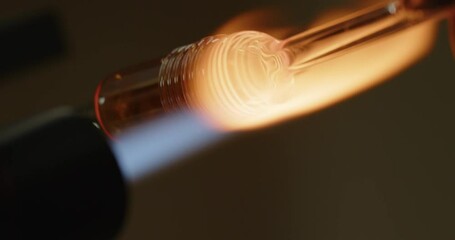 glass blowing art close up in torch flame