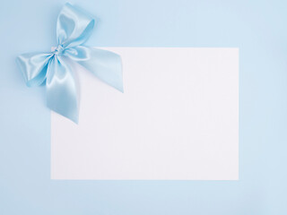 Blue bow on a blue background.