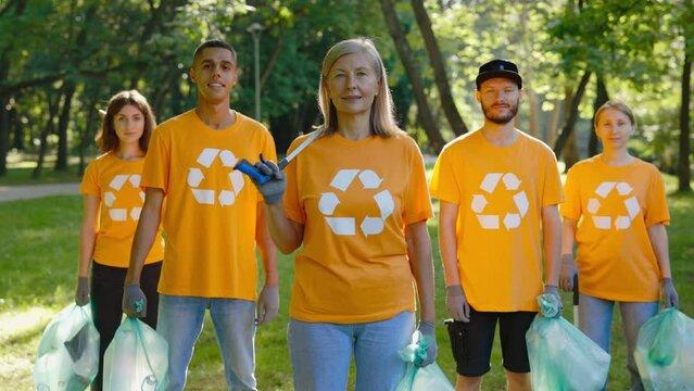 Portrait of the Multiethnic Group of Eco Activists After Cleaning the Forest from the Garbage Looking at Camera. Volunteers Clean Nature from Trash. Ecological Problem. Green Planet Earth