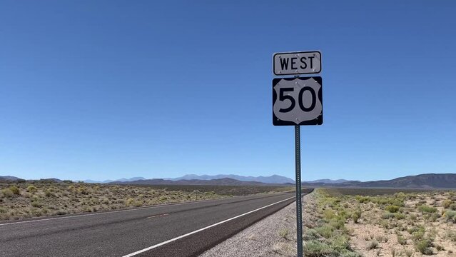US 50 The Loneliest Road in America - Highway 50 Road Sign in Nevada - Route 50 West across the USA. Includes seven different video sequences!