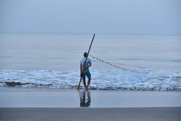 fisher man on the beach 