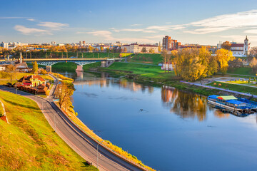 Obraz premium Belarus Traveling. Grodno City Skyline with Traffic Bridge and Catholic Church Across The Neman River
