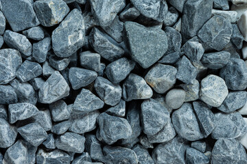 Extreme Closeup Image of Background Made of Pile of Colorful Grey Crushed Stone