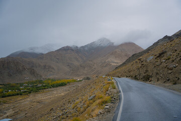 Beautiful view mountain and street view of Khardung La Pass- Leh road on the high mountain covered with snow. It is the highest pass in the world that motorbikes can run through at Ladakh, Leh, India
