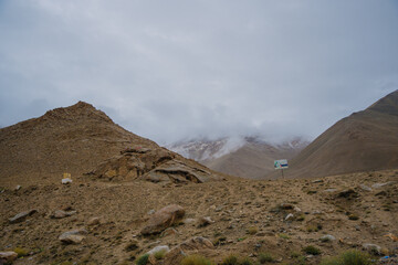 Beautiful view of Khardung La Pass- Leh road on the high mountain covered with snow. It is the highest pass in the world that motorbikes can run through at Ladakh, Leh, India