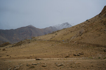 Beautiful view mountain and street view of Khardung La Pass- Leh road on the high mountain covered with snow. It is the highest pass in the world that motorbikes can run through at Ladakh, Leh, India