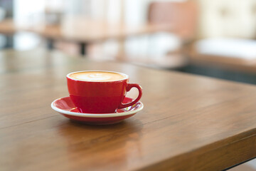 red coffee cup on table