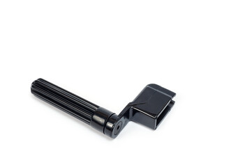 Plastic guitar string winders in black, shot on a white background.