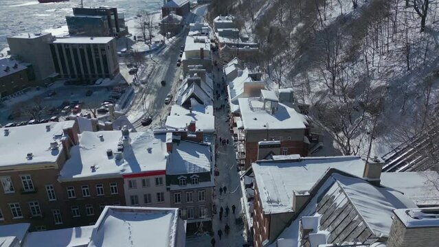 Quebec city in winter. Slow reveal of petit champlain. Drone Shot
