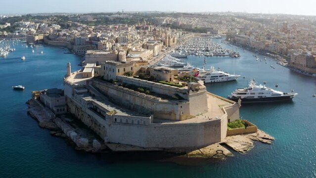 Panoramic Aerial View Of Fort St Angelo Rocky Beach In Birgu, Malta. Wide Shot
