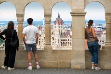 People admiring the parliament building from the fishermen's bastion