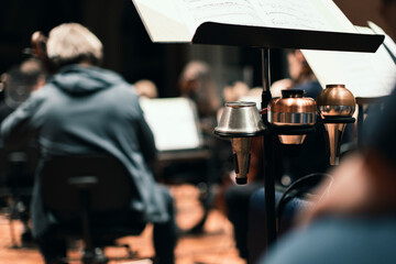 Three trumpet mutes, a cup, bubble or harmon and straight mute mounted on a music stand