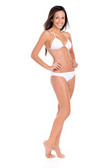 Fototapeta premium Shes in perfect shape for summer. Studio shot of a beautiful brunette model in a bikini isolated on white.