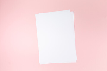 empty white paper sheet on pink background. Mockup