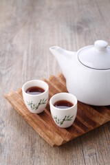 Tea is an aromatic beverage prepared by pouring hot or boiling water over cured or fresh leaves of...