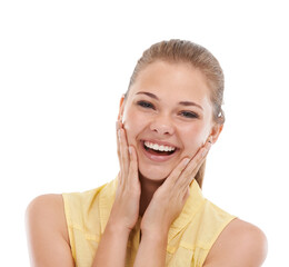 Fototapeta premium My skin is so soft and smooth. A cute young teen girl touchign her face with delight while isolated on white.