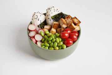 vegan bowl  with onigiri on white background