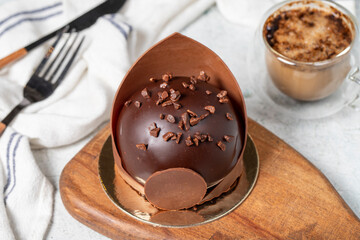 Chocolate cake. Bakery desserts. Delicious round portion cake with cream and dragee filling