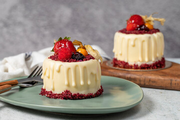 Fruit cream cake. Bakery desserts. Delicious round portion cake with strawberries and cream