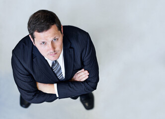 Confidence in the workplace. High angle portrait of a confident looking businessman.