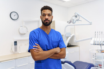 Fototapeta premium Portrait of young multiracial dentist at private dental clinic.
