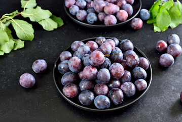 Fresh plums on plate